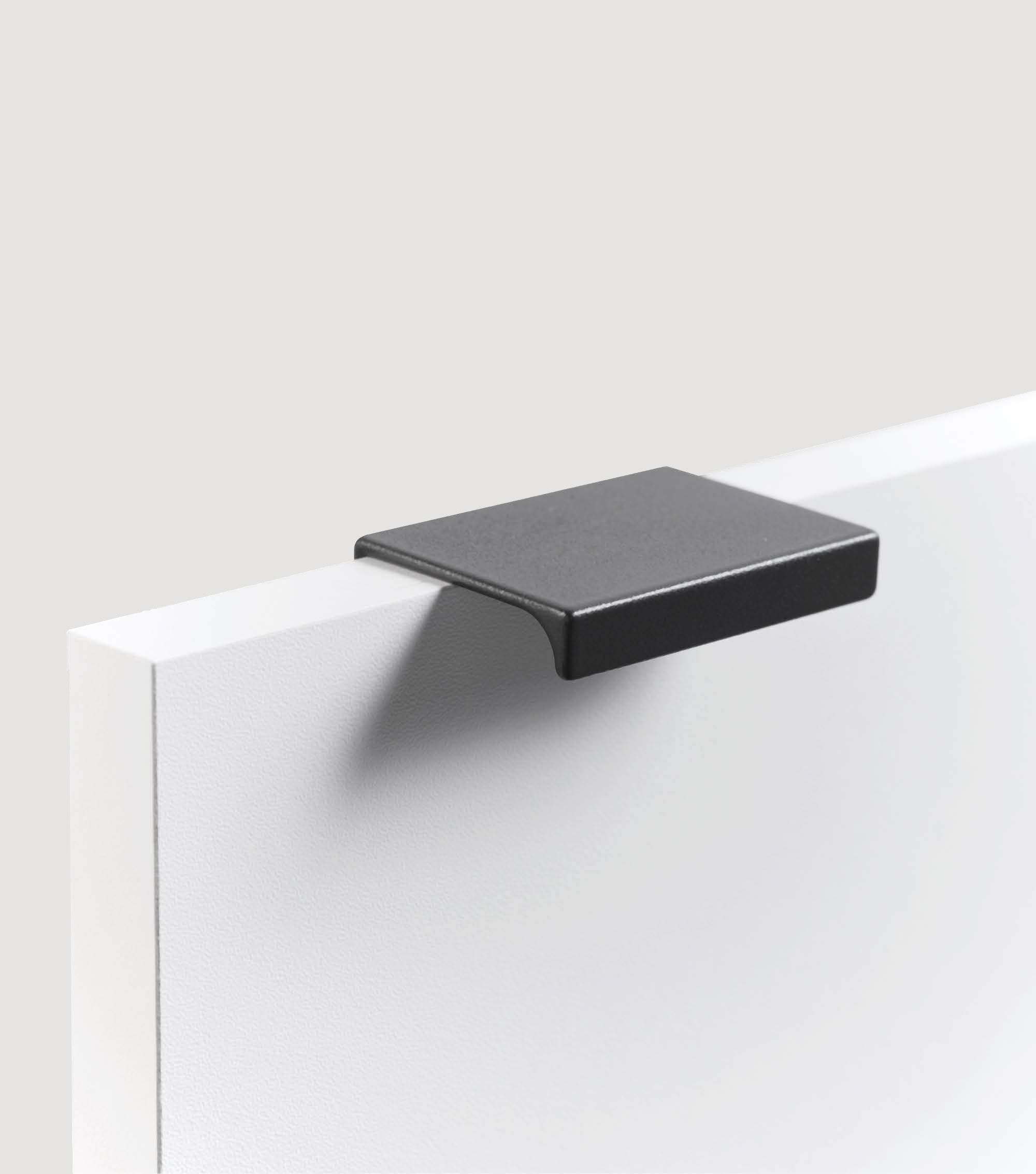 Möbelgriff für Push-to-Open Möbel 'Der Handliche' in Schwarz & Weiß#sku_MG1-L32-5er-set-s#sku_MG1-L32-2er-set-s#sku_MG1-L32-3er-set-s